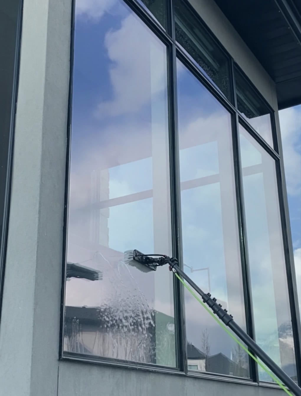 Exterior window cleaning by Alta Cleaning technician in Utah